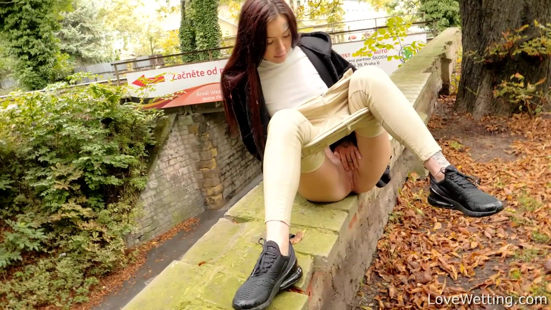 Tabitha Poison pees by public bridge